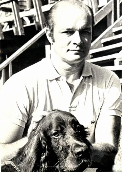 black and white portrait of walt elliot and his dog