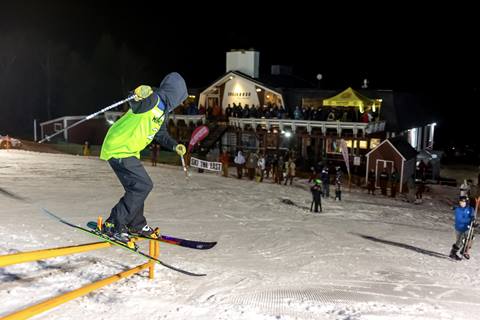 skier on rail at mt ellen rail jam