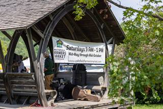 Waitsfield Farmers Market banner hanging in an open barn building 