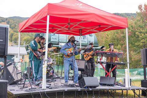 Music playing at Outpour on a stage