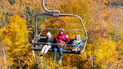 Family on the lift smiling
