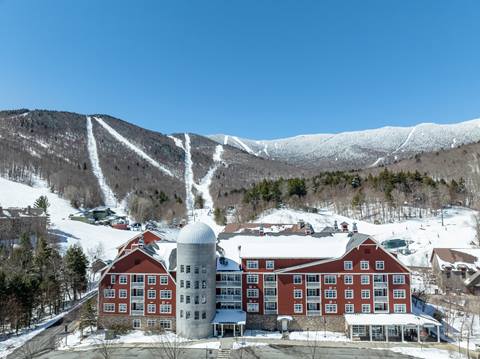Blue sky drone image of claybrook hotel in winter
