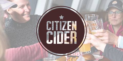 ladies cheersing drinks with a citizen cider logo overlay