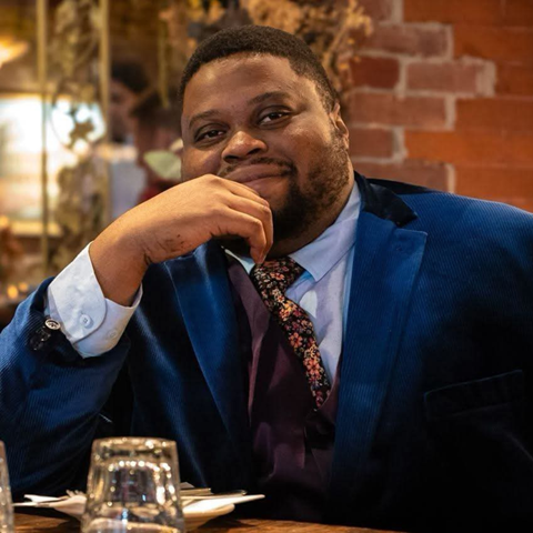 headshot of comedian in a bar