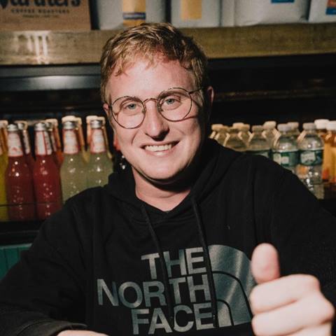 headshot of a comedian in a bar