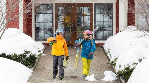 Skiers walking out of Clay Brook 