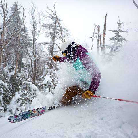 A guy ripping powder