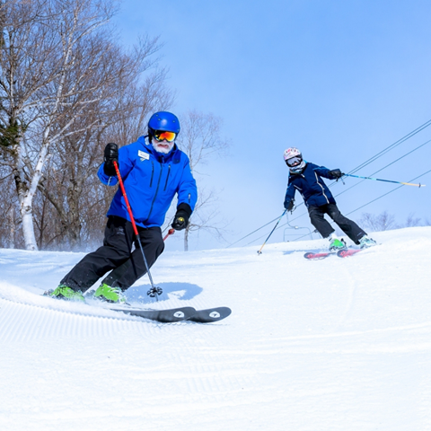 Man skiing with kid