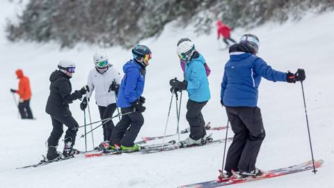 A group of women skiing together