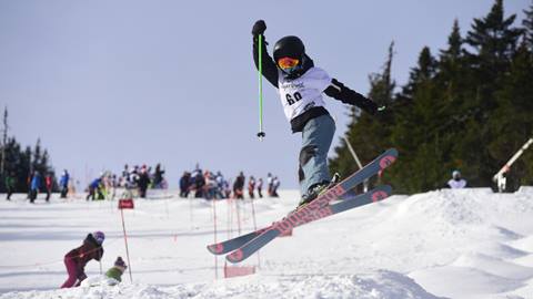 A kid skiing freestyle 