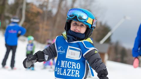 Micro Blazer smiling at the camera