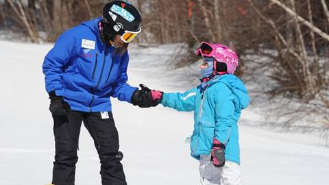 A young instructor with a child