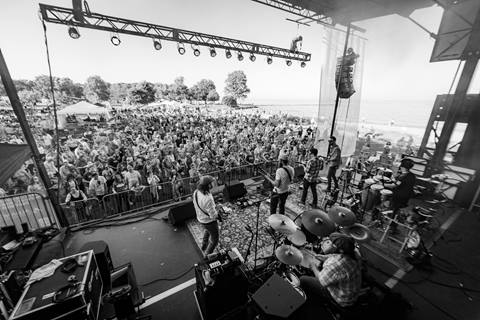 The band Cabinet on stage in front of a big crowd