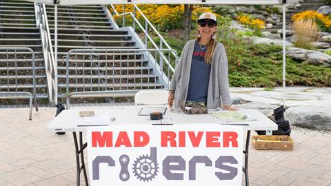 A women tabling at Community Day