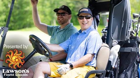 Women smiling in a golf cart