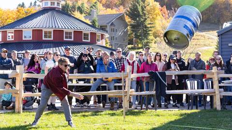A man throwing a keg at Oktoberfest