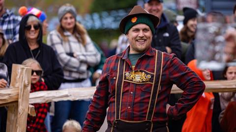 A man dressed in German attire at Oktoberfest