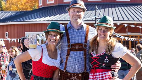 A group dressed in German attire at Oktoberfest