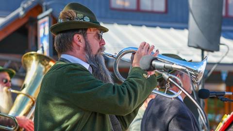 German man playing a brass instrument 