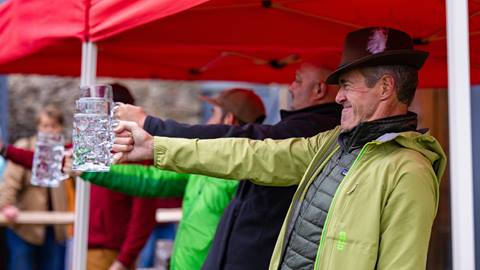 A man struggling to hold a stein