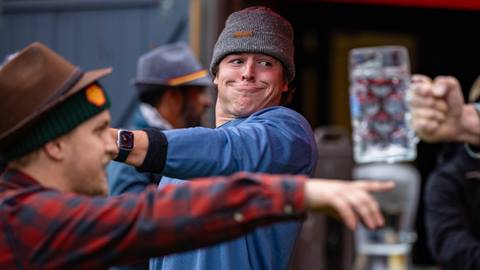 A man struggling to hold a stein