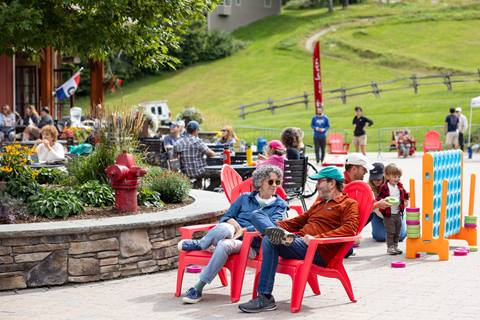 People gathered in the Lincoln Peak Courtyard for live music and games