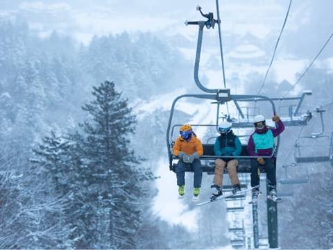 A trio stoked to ski on Super Bravo Lift.