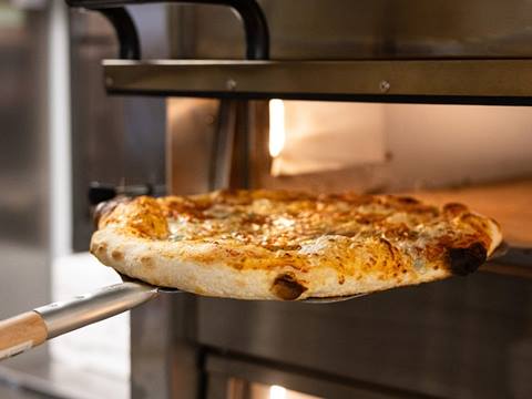 A pizza pie at Paradise Provisions