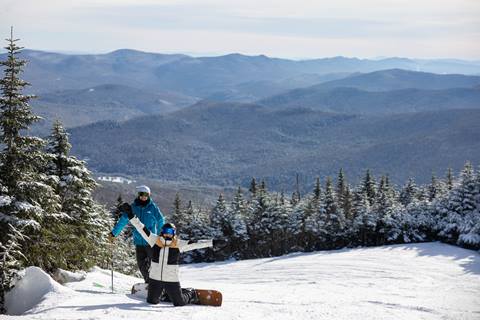 Two friends on a bluebird day smiling 