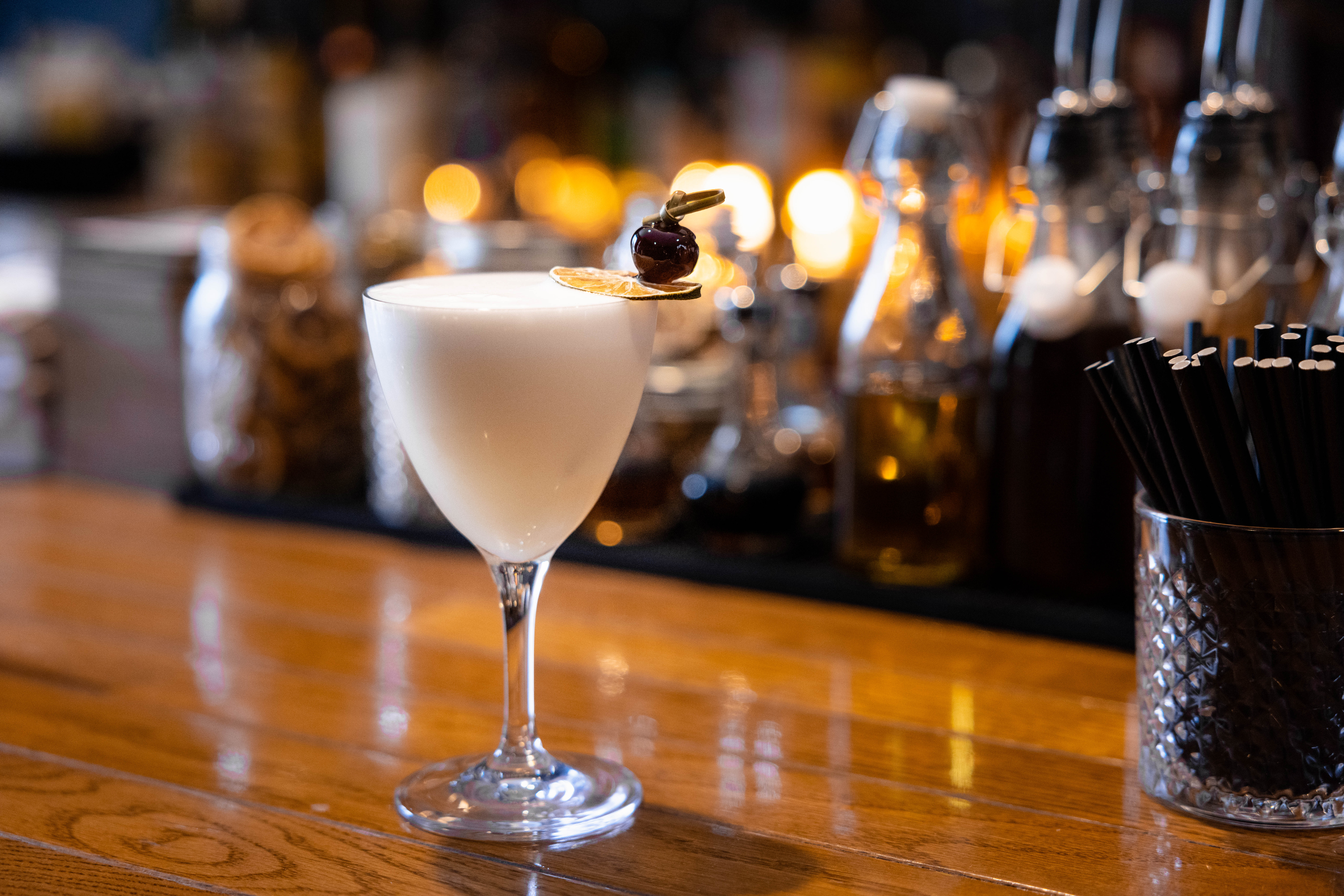 drink on bar with fruit garnish