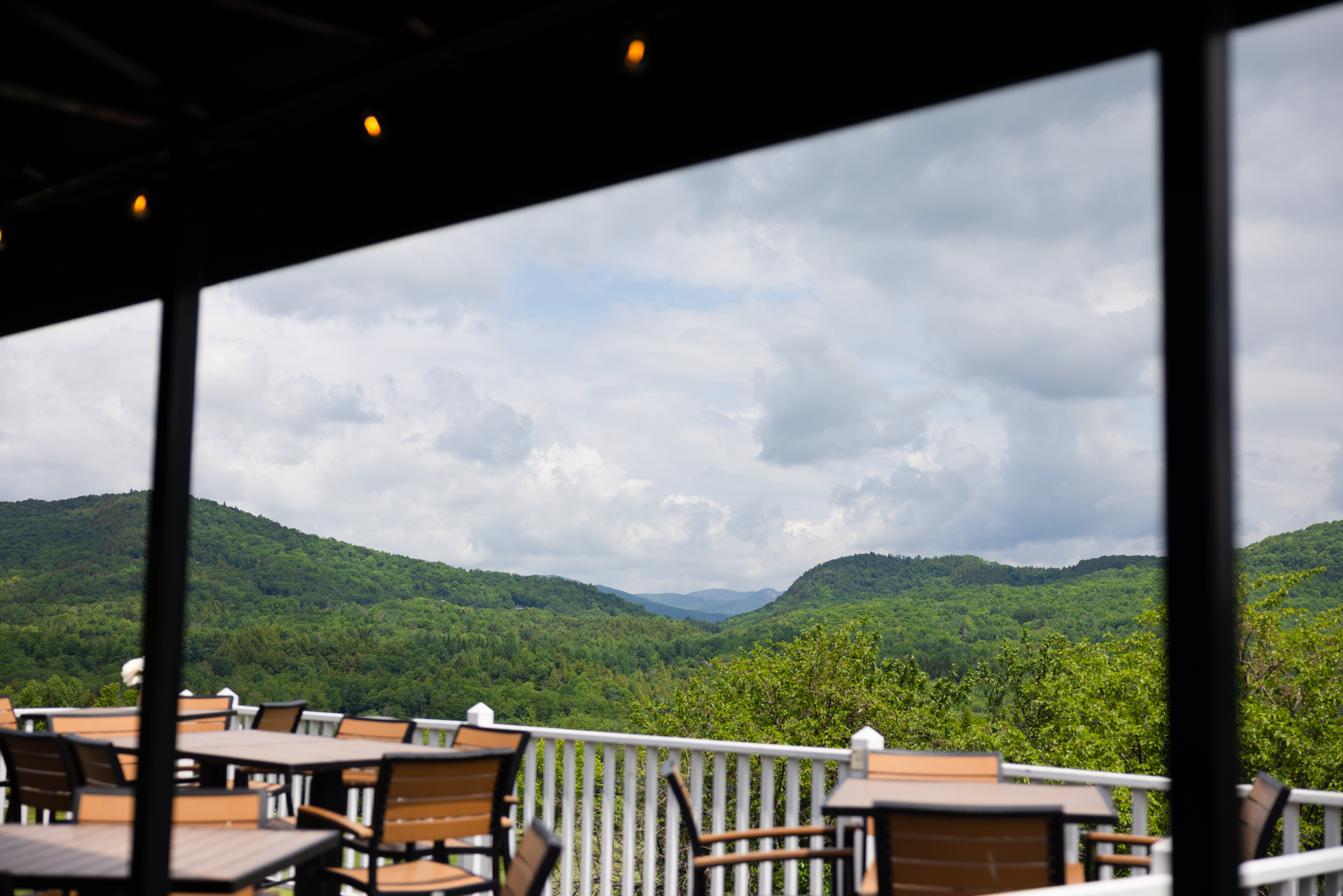 View from deck over golf course and mountains