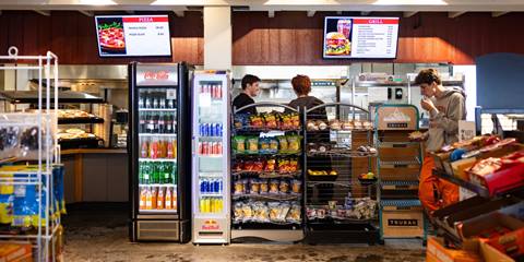 overview of mt ellen cafeteria ordering counter with digital menu screens