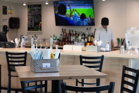 Bar and seating area inside of The Clubhouse