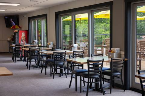 Inside seating next to windows at The Clubhouse