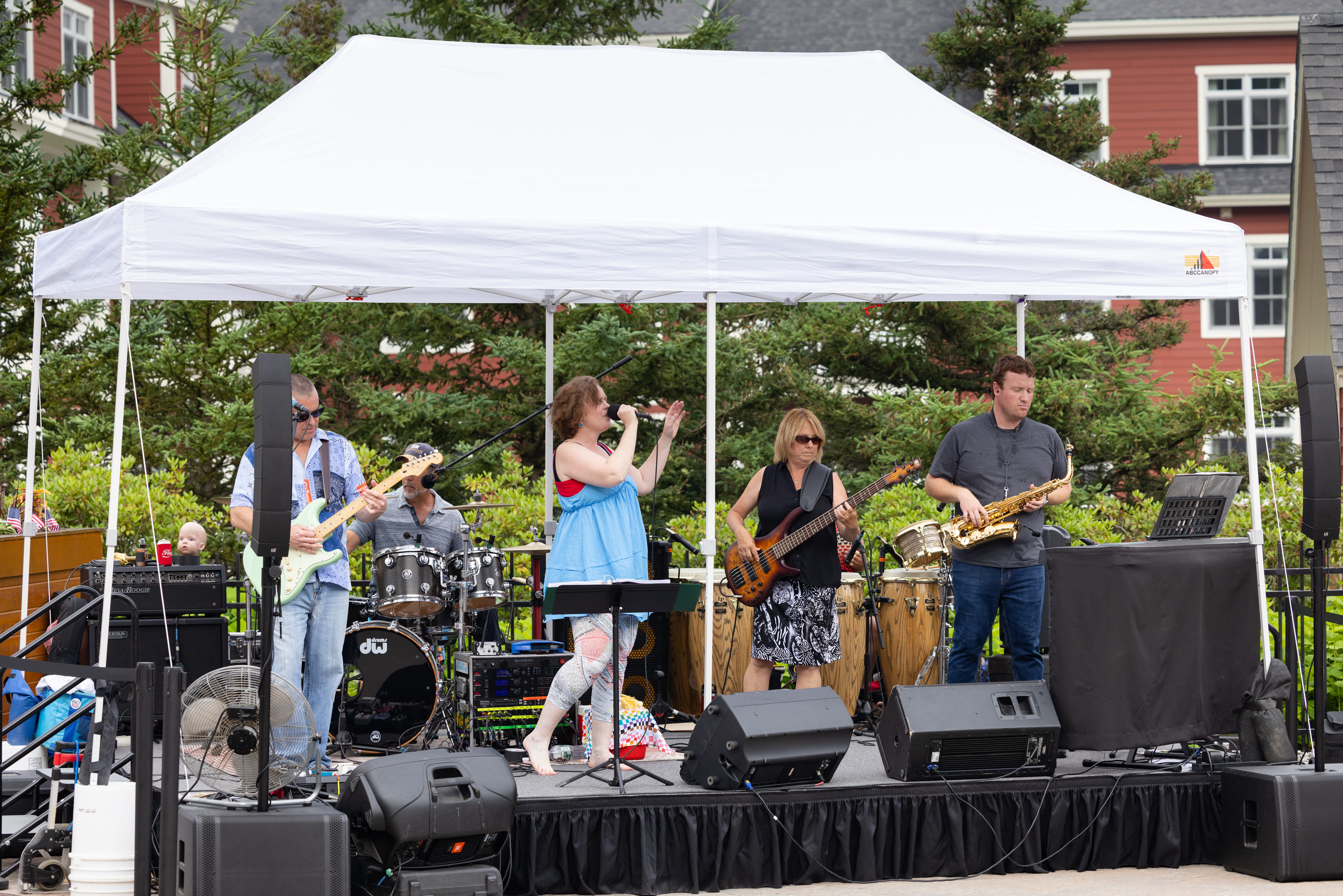band playing under a tent