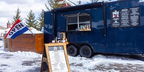 the lunch box with open flag and menu sign in winter