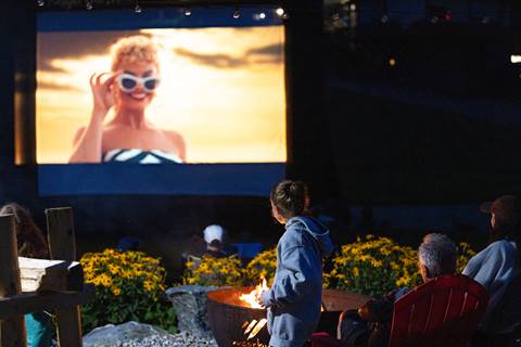 a family watching a movie outside