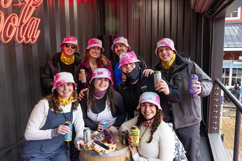 Group of people sharing a drink a bar