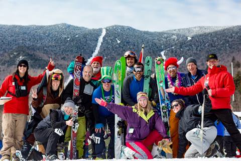 Group of skiers posing with skis