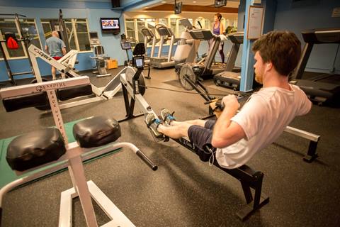 Person using gym equipment at the Sugarbush Health and Recreation Center