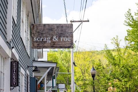 Close up of the Scrag & Rose sign in the mad river valley