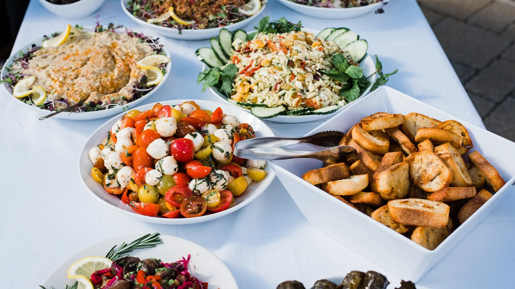 Close up of a table full of plates of food