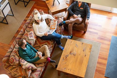 People sitting in a living room in a Claybrook unit