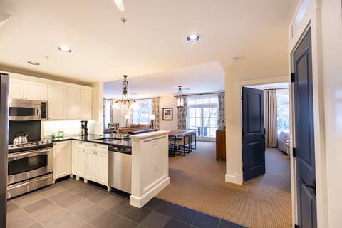 Kitchen and living area inside a Claybrook unit at Sugarbush Resort