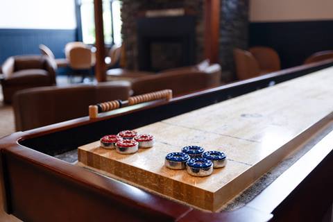 Close up of the shuffleboard table in the lobby of The Lodge at Lincoln Peak