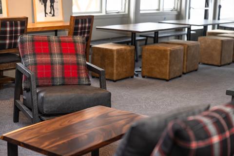 Seats and tables inside The Fifty8 at Sugarbush Resort