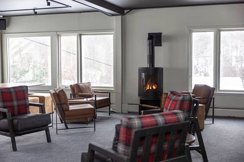 Seats and tables inside The Fifty8 at Sugarbush Resort