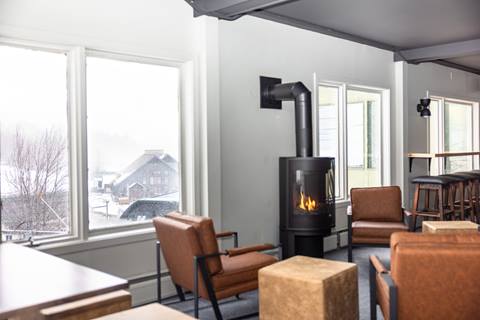 Seats and tables inside The Fifty8 at Sugarbush Resort