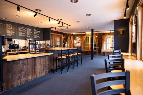 Tables and chairs set up in The Tucker at Sugarbush Resort