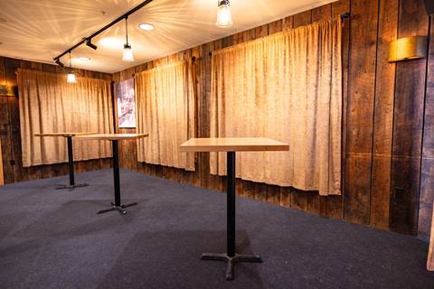 Tables and chairs set up in The Tucker at Sugarbush Resort